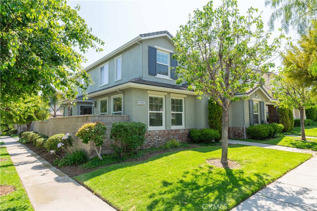 Perfection in Porter Ranch! Welcome to this upgraded plan 2 Arbor, located in the guard-gated & prestigious community of Promenade. Situated in a prime location, only a few steps to the sparkling & inviting community pool & spa. Upon entering this gorgeous masterpiece, you are greeted by custom floors. The cook's kitchen proudly boasts a breakfast bar, breakfast nook, plenty of cabinet/storage/pantry space & more. Grand living room, featuring a built-in media niche & dual-sided fireplace. The dining area is perfect for entertaining, Holiday gatherings and family meals & is highlighted by a built in cabinet. Travel upstairs to find 3 large bedrooms, including an impressive master suite. The master suite features a huge walk-in closet. Also located upstairs is a convenient, built-in desk, which is perfect for a home office or homework station. 2 car attached garage with direct access. This townhome is attached to only one other unit, making it an end unit. Promenade offers a sparkling & inviting community pool & spa, plenty of park benches for picnics. Promenade is also located in the highly sought after Porter Ranch Community School K-8 district (Per LAUSD website. Buyer is encouraged to independently verify). Conveniently located near the amazing Vineyards shopping center, where you can enjoy fine dining, a state of the art AMC movie theater, Whole Foods with a restaurant & so much more. If you are looking for the best of Porter Ranch, your search is over.