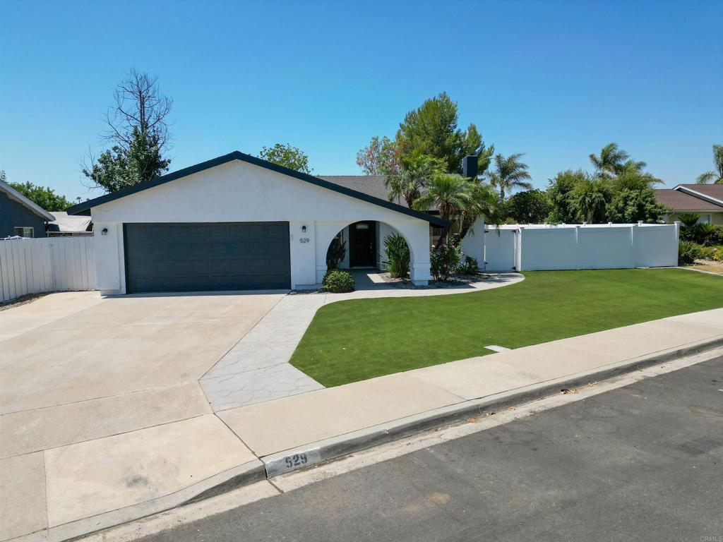 This fully renovated 3-bedroom, 2-bath home offers 1,360 sq. ft. of stylish, move-in-ready living with a bright and open floor plan. Recent upgrades include a brand-new roof, a modern kitchen with sleek finishes, new flooring throughout, fully painted interior and exterior, and updated bathrooms with elegant touches. Step outside to fresh landscaping and a spacious backyard—perfect for entertaining, gardening, or play—complete with jacuzzi hook-ups for future relaxation. The property also offers RV parking with wired hook-ups, ideal for extra vehicles or recreational toys. With all major updates complete, this home delivers modern comfort, functionality, and space in a desirable Escondido location.
