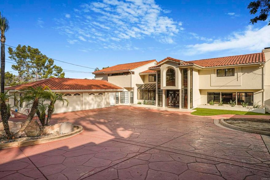 Welcome to 5274 Margaret St, a one-of-a-kind luxury estate in the heart of Bonita, offering nearly 6,000 sq. ft. of living space at under $400 per square foot — a rare opportunity to own a property of this caliber in San Diego County priced well below replacement cost.  Privately set behind gates at the end of a cul-de-sac, this fully furnished residence combines resort-style amenities, modern upgrades, and timeless elegance. With 5 bedrooms, 8 bathrooms, a detached ADU, 3-car garage, and a massive gated driveway, this property was designed for both everyday comfort and grand entertaining.  Step inside to an open-concept layout filled with natural light. The chef’s kitchen features stainless steel appliances, stone counters, and direct flow into the formal dining room, multiple living areas, and a game/cigar lounge with full bar. A second family room with its own bar makes hosting effortless. The primary suite is a true retreat, offering a private deck, spa-inspired bath, oversized soaking tub, and a brand-new custom sauna. Upstairs, ensuite bedrooms feature walk-in closets and private balconies for family or guests.  Recent upgrades include: New flooring throughout Fresh interior & exterior paint New hardware & appliances Dual-zone A/C upgrades Large paid-off solar system Water heater upgrades Whole-home speaker system  The backyard is your private oasis with a heated pool and water slide, oversized jacuzzi, outdoor sound system, and lush mature landscaping — perfect for both lively pool parties and quiet evenings under the stars. The detached ADU offers a living room, kitchenette, bedroom, and full bath, ideal for extended family, guests, or rental income.  With its combination of luxury features, extensive upgrades, and unbeatable value per square foot, 5274 Margaret St is a truly exceptional offering. Minutes from shopping, dining, golf, hiking, and horse trails, this estate blends privacy, convenience, and world-class living in one.