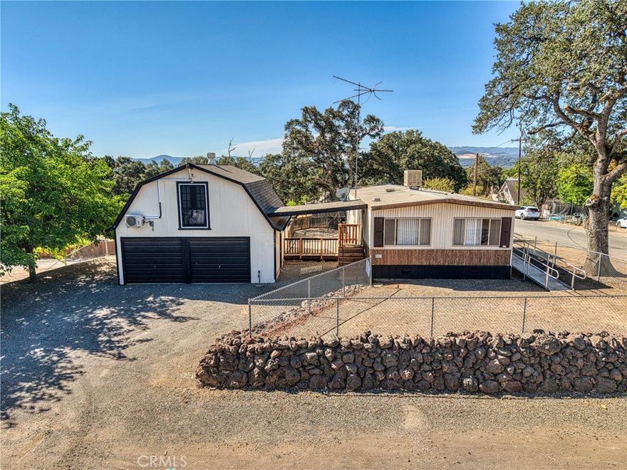 Discover this charming 2-bedroom, 2-bathroom home on an oversized lot at 15785 45th Ave in Clearlake. With 1000 square feet of comfortable living space, this property offers excellent investment potential with dual rental income opportunities.



The main house is in great condition and features convenient wheelchair access through a front door ramp. Currently rented to a wonderful family, it provides immediate rental income. The property sits on a fully gated lot, offering privacy and security for tenants and owners alike.



A standout feature is the large garage topped with a studio apartment that includes a full bathroom and a brand-new mini-split system for year-round comfort. This studio has its own separate entrance, making it perfect for additional rental income or guest accommodations.



Located in a convenient Clearlake neighborhood, you'll find Foods Etc grocery store less than a mile away for daily shopping needs. Redbud Park is nearby for outdoor recreation, while Clearlake Education Centers and other local amenities are easily accessible.



The property's dual access design ensures privacy for both units - the main home and studio operate independently. This setup is ideal for investors looking to maximize rental returns or homeowners wanting extra income potential.



With ample parking space, a secure gated lot, and two separate living areas already generating income, this property presents a solid investment opportunity in Clearlake's growing market. The wheelchair-accessible main entrance and well-maintained condition make this an attractive option for various tenant needs.