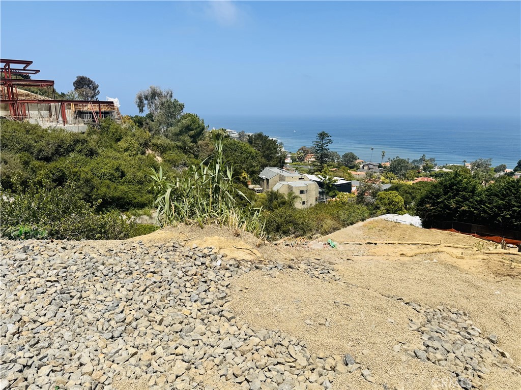 Welcome to one of La Jolla’s last remaining premier unobstructed ocean view lots—a rare opportunity to build your dream estate on Hillside Drive, perched above the coastline with panoramic, unobstructed views of the Pacific Ocean, La Jolla Shores, La Jolla Cove, and stunning sunsets that stretch to the horizon. This is one of only a few unobstructed and undeveloped large lots in one of the most exclusive neighborhoods of La Jolla. The lot is surrounded by multimillion dollar estates, with new home developments on the street selling for over $15 million dollars. This expansive parcel offers unmatched potential, with approximately 0.55 acres of gently sloped land, ideal for a luxury custom home with indoor-outdoor living, infinity pool, terraced gardens, and an ADU with ocean view. The lot has active permits and construction plans for quick development. The site is nestled among multi-million-dollar estates in one of La Jolla’s most prestigious and serene enclaves. In addition, the lot is right next 7520 Hillside Dr, which is an older existing house on a large lot that was just put on the market. That house has lots of undeveloped frontage and land which presents a great investment opportunity to combine with our lot for further development and expansion of both properties. The lot has an expired Costal Commission permit for a 7000sqft house, architectural and structural engineering plans, soil and environmental reports, cultural reports and recent recorded surveys. Key Features: • Unobstructed Ocean Views throughout the lot • Generous lot size with wide frontage and deep depth • Next door property also for sale to allow for further investment and development opportunities. • Elevated topography for maximum privacy and breathtaking views • Ready for development – utilities nearby, street access • Minutes to the Village, world-class beaches, schools, shopping, and dining • No HOA, flexible design options (verify with city zoning) This is a once-in-a-generation opportunity for developers, investors, or private buyers to secure one of the most coveted locations in coastal Southern California. Whether you’re designing a legacy home or holding as an appreciating asset, this lot offers both vision and value.