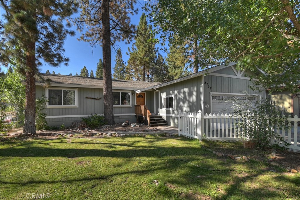 ~Storybook Charm~ Tucked away on one of Big Bear's hidden gem streets, this storybook home is the perfect blend of charm, comfort, and mountain living. Offering 1,400 sq. ft. of well-cared-for space, pride of ownership is evident throughout. With 3 bedrooms and 2 full baths, the layout is thoughtfully designed—featuring a private primary suite on one side of the home and two additional bedrooms with a full bath on the opposite wing for ideal separation. The kitchen flows seamlessly into the living area, creating an open and inviting setting perfect for gatherings. Step outside into your own secret garden paradise—a spacious double lot (14,922 SQFT) surrounded by lush landscaping, mature trees, and endless outdoor areas to explore. Whether you envision quiet mornings with coffee, summer BBQs, or even future expansion with room for an ADU, the possibilities are endless. Conveniently located just 12–15 minutes from town, the ski slopes, shops, and restaurants, yet offering quick access to Hwy 38 for easy commuting. Hiking trails and outdoor adventures are nearby, all within a neighborhood that radiates a true mountain feel. Don’t miss the chance to own this enchanting retreat—perfect as a full-time residence or a vacation getaway in the mountains.