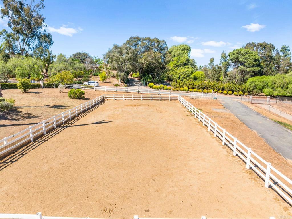 Endless Possibilities in Fallbrook! This 1.15-acre lot is ready for your vision. The property features a fenced horse arena and an impressive detached garage/workshop nearly 1,400 sq. ft. with three roll-up doors—one tall enough to accommodate an RV. Utilities are ready to go with electrical available at the end of the driveway and water already set up, making this an ideal site for your next project. Whether you’re looking to create the perfect equestrian setup, store your toys, or build your dream home, this versatile property offers the space and functionality you’ve been searching for. Located in Fallbrook’s peaceful countryside, yet just minutes from town conveniences, with coastal a coastal climate and rural feel, this lot is a rare find that blends practicality with potential. If you don't want to build your own home, the lot next door is listed for sale complete with a 2 bedroom, 2 bath plus ADU and pool! MLS NDP2508923