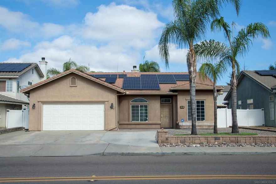Welcome to this beautifully refreshed 4-bedroom, 2-bath single-family home located in a peaceful Ramona neighborhood. Offering 1,614 sq ft of comfortable living space, this move-in ready property features thoughtful updates and no HOA.  Step inside to find new interior paint and brand-new carpet throughout, creating a fresh and inviting atmosphere. The layout includes a separate dining room—ideal for family meals or entertaining—alongside a spacious kitchen with ample cabinet and counter space.  The primary suite includes a generous walk-in closet and a private bath, while three additional bedrooms offer flexibility for guests, a home office, or hobbies. Enjoy the outdoors in your private backyard, perfect for relaxing, gardening, or hosting weekend BBQs. Additional highlights include an attached garage and solar, helping support energy efficiency and lower utility bills.  Located in the heart of Ramona, this home offers small-town charm with close proximity to schools, parks, shops, and more—without the burden of HOA fees or restrictions.  Don’t miss your chance to own this updated and energy-conscious home in a great location.