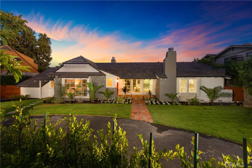 Refined Living in Arcadia’s Coveted Lower Rancho Neighborhood. Nestled on a generous lot in one of Arcadia’s most prestigious enclaves—Lower Rancho, affectionately known as “Peacock Area”—this impeccably remodeled single-story residence offers the perfect blend of timeless elegance and modern comfort. From its inviting curb appeal with circular driveway, to the thoughtfully curated interior and backyard retreat, every detail of this home has been designed for luxurious California living. The main residence features 3 spacious bedrooms and 3.5 tastefully appointed bathrooms. A bright and airy floor plan welcomes you with abundant natural light, rich hardwood flooring, and elegant architectural details throughout. At the heart of the home lies a chef’s kitchen, complete with a central island, high-end stainless steel appliances, custom cabinetry, and a cozy breakfast nook—ideal for casual dining and everyday gatherings. A rare highlight is the built-in brick pizza oven, adding character and functionality for those who love to entertain or enjoy gourmet cooking at home. The expansive living and family rooms each boast their own fireplace, offering warmth and charm for relaxing evenings or hosting guests. The luxurious primary suite is a true sanctuary, featuring a large walk-in closet, additional storage, and a beautifully upgraded en-suite bath with premium fixtures and finishes. Step outside to a private backyard haven designed for entertaining and tranquility. Enjoy sunny afternoons by the resort-style pool, or dine al fresco under the stars on the spacious patio. The detached guest studio—complete with its own kitchen and bathroom—provides exceptional versatility as a home office, creative space, guest suite, or even rental potential. Located within the award-winning Arcadia Unified School District and just moments from the Los Angeles County Arboretum, Santa Anita Park, Westfield Santa Anita Mall, and a variety of fine dining and retail options, this home offers the ideal balance of peaceful suburban living with convenient urban access. Don’t miss this rare opportunity to own a beautifully upgraded home in one of Arcadia’s most desirable neighborhoods.