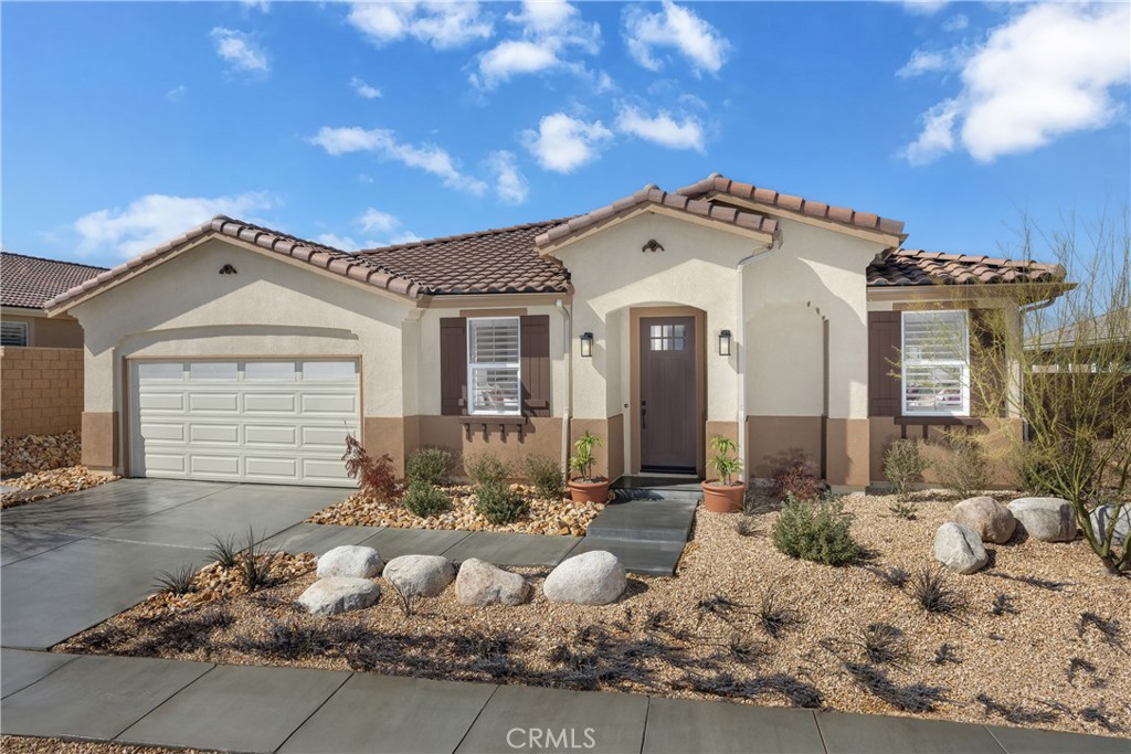 Only 2 Homes Remain – Pacific Jasper Plan 2!
Experience modern high desert living in this stunning single-story home with 2,111 sq. ft., 4 bedrooms, and 2 baths. The open-concept layout seamlessly connects the spacious kitchen with a large walk-in pantry to the living and dining areas, perfect for everyday life and entertaining. The primary suite boasts a huge walk-in closet, while each secondary bedroom offers privacy and comfort for family or guests.
Step outside to a large backyard with endless possibilities! Imagine hosting summer barbecues, installing a pool, creating a private garden, or designing your dream patio retreat to enjoy the California sun. The home also features upgraded flooring throughout, luxurious finishes, and thoughtful touches that combine style with function.
Located in a convenient neighborhood just minutes from schools, shopping and dining this home offers both comfort and connectivity. With NO HOA fees and only two Plan 2 homes remaining, this is your chance to secure a move-in ready home that delivers space, style, and freedom to create your perfect lifestyle.