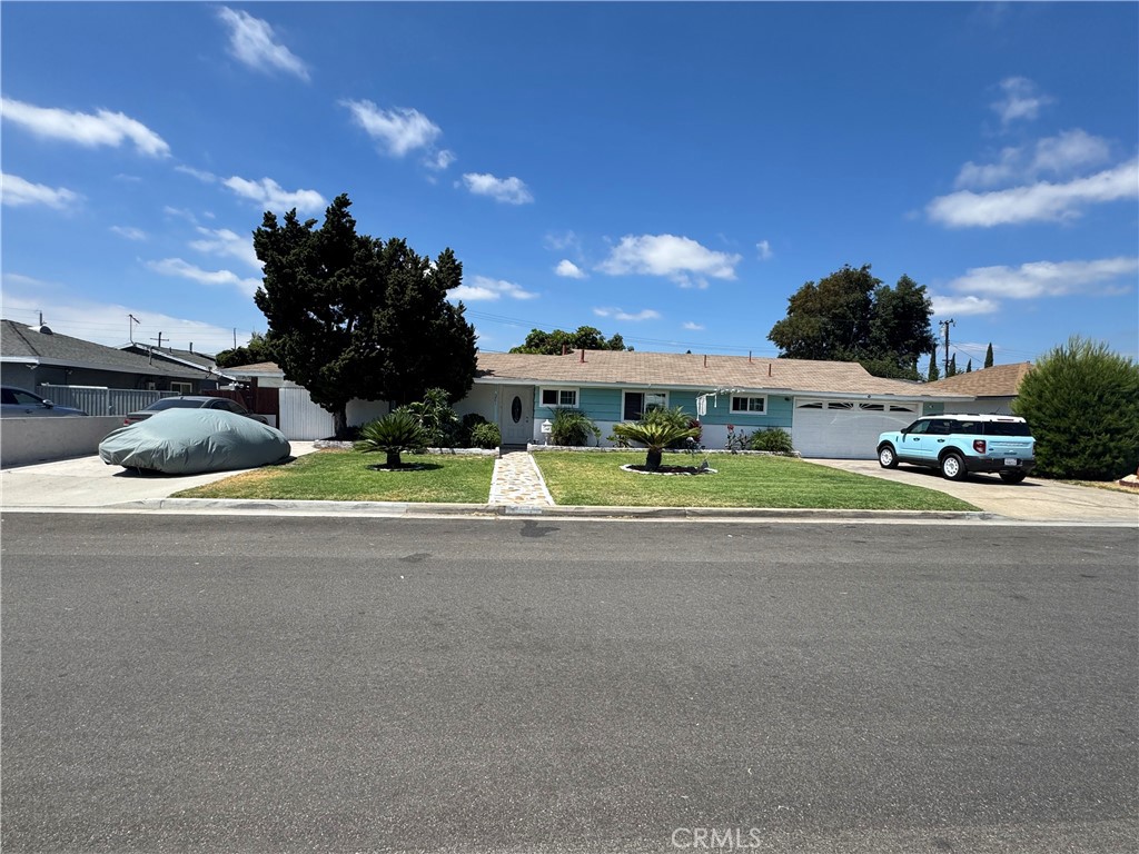 Outstanding opportunity to own this lovely Garden Grove four-bedroom two full bath home with a pool on a large lot. Large nicely landscaped grassy front yard with two driveways to accommodate plenty of parking as well as a two-car garage. Spacious master bedroom that opens onto rear sunny and lushly landscaped and grassy rear gardens and patio areas. Perfect for a growing family or multigenerational household. Large backyard with three patio areas and a sunny pool area with a slide. Excellent ADU potential. Perfect for children or those who love to swim. This lovely home is located on an extra wide street in a lovely neighborhood. Welcome to your new home!
