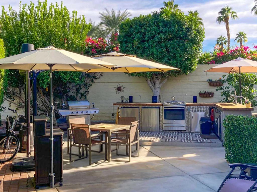Enjoy your own private RV oasis, perfectly located across from the pool, hot tub, and laundry. Ownership at Outdoor Resort Indio includes access to all resort amenities -- golf, tennis, pickleball, fitness center, clubhouse, and more -- all within a gated, luxury RV community.This beautifully landscaped perimeter lot offers privacy and thoughtful upgrades designed for comfort and functionality. Enjoy landscaping with a grapefruit tree and separate irrigation for pots. Entertain or relax with ease using the mobile, movable kitchen -- complete with a custom steel walking platform -- that can be set up in three different locations depending on your needs. Additional features include a water softener, perimeter lighting for evening ambiance, and a spacious layout ideal for hosting guests or simply enjoying your own retreat. This is RV living at its finest.‍