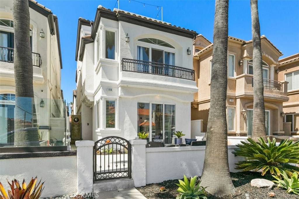 SHORT TERM (1 month minimum) or LONG TERM LEASE, FULLY FURNISHED, model perfect, beach getaway! AVAILABLE August 15, 2025 onward. Ideally set back from PCH and located on the preferred north side of 18th Street’s 100 block, this impeccable dream home offers white water and Catalina views. Featuring 3 bedrooms (with a 3rd floor loft that can easily be used as a 4th bedroom), 3.5 baths and graced with natural light throughout each level. A moment from the sand and less than a mile walk to Main Street, the home has been remodeled with modern harmony embracing the HB coastal lifestyle. The kitchen has been redesigned with handmade, custom inset cabinetry topped with custom quartz countertops. Ideal for entertaining, enjoy newer stainless steel Kitchen Aid appliances, a gorgeous waterfall island that doubles as an eating area, and an open flow into a living area that opens to a private patio complete with bbq. The two-toned kitchen is also graced with soft backsplash as well as modern hardware and fixtures. Wire brushed oak flooring with custom stair treads are complimented by the custom iron railing on each thoughtful level. Each bathroom has the ocean breeze in mind with soft colors and designer finishes. On the second level, enjoy magnificent ocean views from bed or the balcony in the primary bedroom. Walk-in finished primary closet with custom built-in cabinetry just beyond a new world class spa inspired bathroom. A large living area complete with a fireplace, 2 more bedrooms (one with ocean views) and a full bathroom round out the second level. The third level offers a spacious living area, a full bath and direct access to a rooftop deck where you can enjoy gorgeous ocean views, breezes and what Surf City is all about! RATES FLUCTUATE SEASONALLY