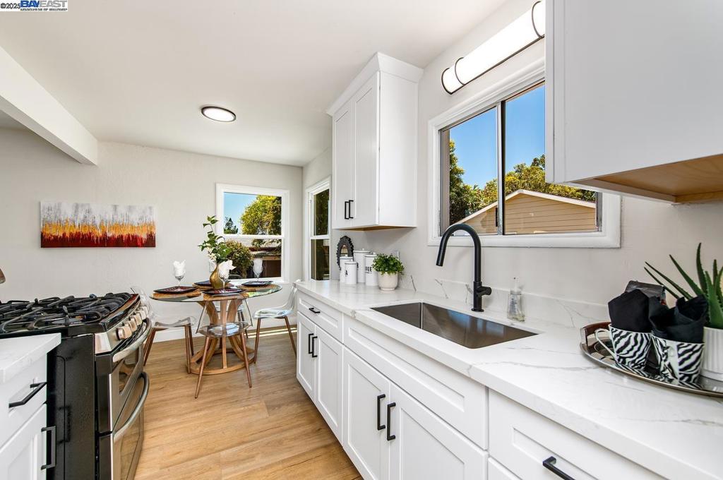 Welcome to 17673 Dorson Lane,a beautifully remodeled single-story home tucked in the heart of Castro Valley. From the moment you arrive, you’ll feel the care and attention that’s gone into every corner of this light-filled home offering 3 bedrooms, 1 bathroom, and 1,234 square feet of thoughtfully designed living space. Fresh paint, brand-new flooring, and updated lighting throughout give the home a bright, clean feel, while timeless finishes create a sense of calm and cohesion. The kitchen is a true standout—completely remodeled with quartz countertops, white shaker cabinetry with sleek new hardware, and a stylish new sink. The bathroom has been just as beautifully reimagined with a brand-new tub, vanity, flooring, and lighting—simple, beautiful, and totally move-in ready. But what truly sets this home apart is the detached bonus space tucked quietly behind the main home. With its own private entrance, it’s the kind of flex space that works for your life—whether you need a quiet place to work from home, a guest retreat, creative studio, or even potential rental income down the line. The backyard offers space to relax, garden, or entertain, and the location is ideal—close to local shops, Castro Valley schools, parks, and commuter routes.
