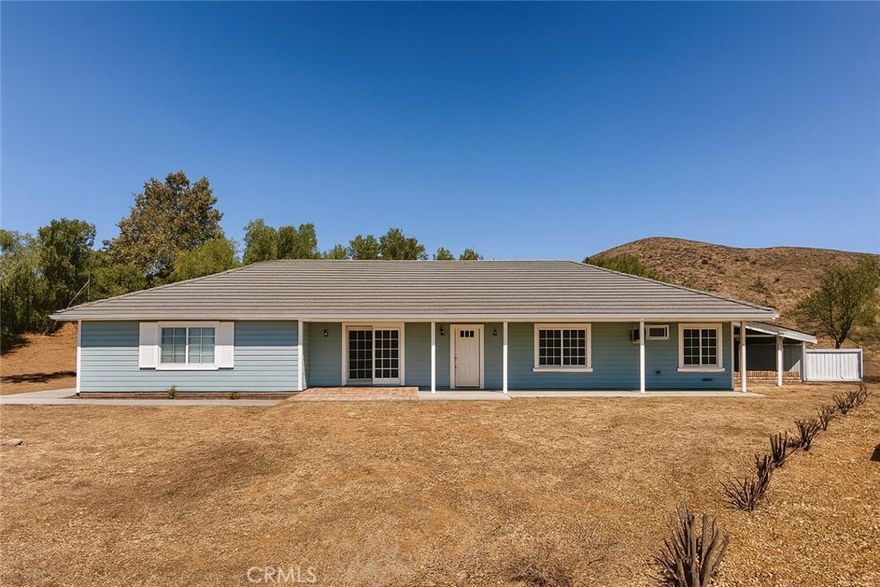 Outstanding ranch style view home on 2.59 acres featuring 4 spacious bedrooms, 3 bathrooms, an open kitchen flowing into the family room with a classic brick fireplace, beam mantle, and sliding dual-pane doors leading to a covered patio and outdoor kitchen area perfect for entertaining. The property offers central AC and heat, city water and power, A2 zoning for horses or other livestock, a separate laundry/mudroom with backyard access, and a converted 3-car garage workshop with 220v power and storage. A wide concrete driveway provides plenty of parking for RVs, boats, and more, while the expansive lot offers room for a pool, garden or play areas, all supported by a front, rear, and side-yard sprinkler system. Conveniently located just minutes from the 14 freeway, yet private and peaceful, this home is ready for your personal touches to make it truly your own. Schedule your private showing today and discover why this could be your next home. To help visualize this home’s floor plan and to highlight its potential, virtual furnishings may have been added to photos found in this listing.