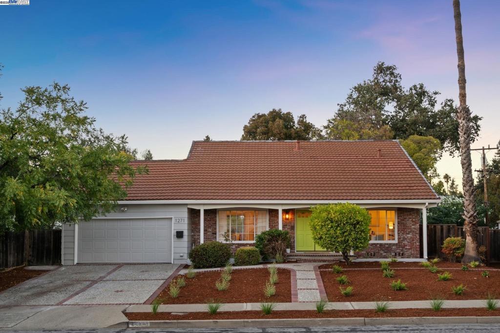Light, airy, and spacious, this Mid-century 4+BD/2BA Concord home offers easy living near the beautiful Mount Diablo foothills. The 2091 SQFT home welcomes you with a newly landscaped Mediterranean garden anchored with mature trees and a towering California palm. The sunny living room invites you to relax in front of a picture window of the garden. Wonderful flow leads from the living room to the heart of the home - the connected dining room, kitchen, and den with a fireplace and sliding glass doors to the backyard. Enjoy preparing meals in the kitchen while family and friends unwind in the den. Surrounded by mature landscaping, the expansive backyard and patios provides plenty of room to dine al fresco, entertain, play, garden, or potentially add an ADU or create your own oasis. Back inside, the first floor is complete with a roomy office and a primary suite enjoying a backyard view and a stylish new split bathroom. Upstairs find three bright bedrooms and a full bathroom with a dual vanity. Other recent upgrades include new flooring and recessed lighting. The 2-car garage has storage galore, a sink, laundry area, and interior access. With BART down the road, your commute is easy. Nearby, enjoy top schools, Len Hester Park, & miles of trails on the Iron Horse Regional Trail.
