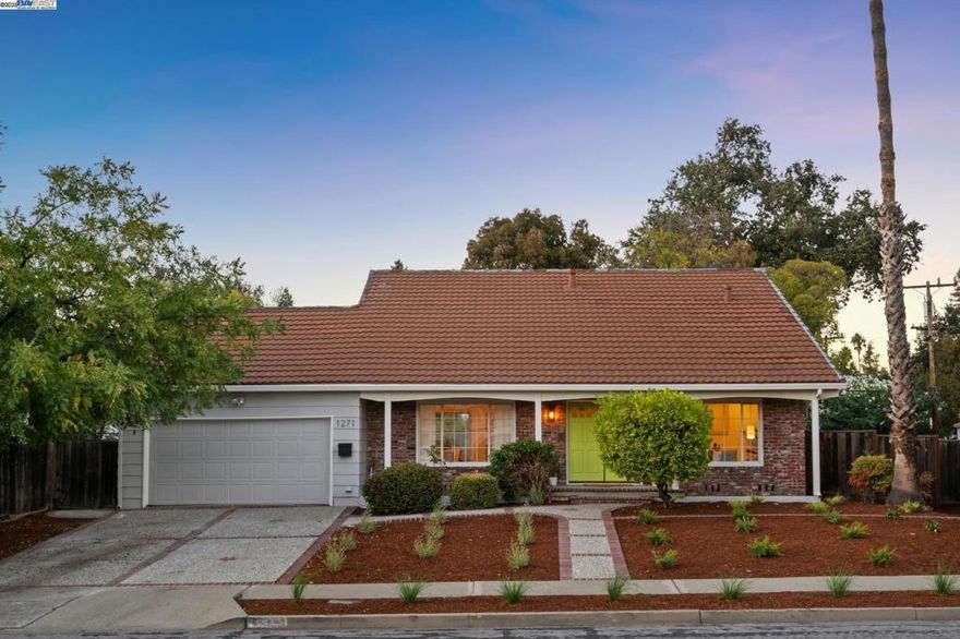 Light, airy, and spacious, this Mid-century 4+BD/2BA Concord home offers easy living near the beautiful Mount Diablo foothills. The 2091 SQFT home welcomes you with a newly landscaped Mediterranean garden anchored with mature trees and a towering California palm. The sunny living room invites you to relax in front of a picture window of the garden. Wonderful flow leads from the living room to the heart of the home - the connected dining room, kitchen, and den with a fireplace and sliding glass doors to the backyard. Enjoy preparing meals in the  kitchen while family and friends unwind in the den. Surrounded by mature landscaping, the expansive backyard and patios provides plenty of room to dine al fresco, entertain, play, garden, or potentially add an ADU or create your own oasis. Back inside, the first floor is complete with a roomy office and a primary suite enjoying a backyard view and a stylish new split bathroom. Upstairs find three bright bedrooms and a full bathroom with a dual vanity. Other recent upgrades include new flooring and recessed lighting. The 2-car garage has storage galore, a sink, laundry area, and interior access. With BART down the road, your commute is easy. Nearby, enjoy top schools, Len Hester Park, & miles of trails on the Iron Horse Regional Trail.