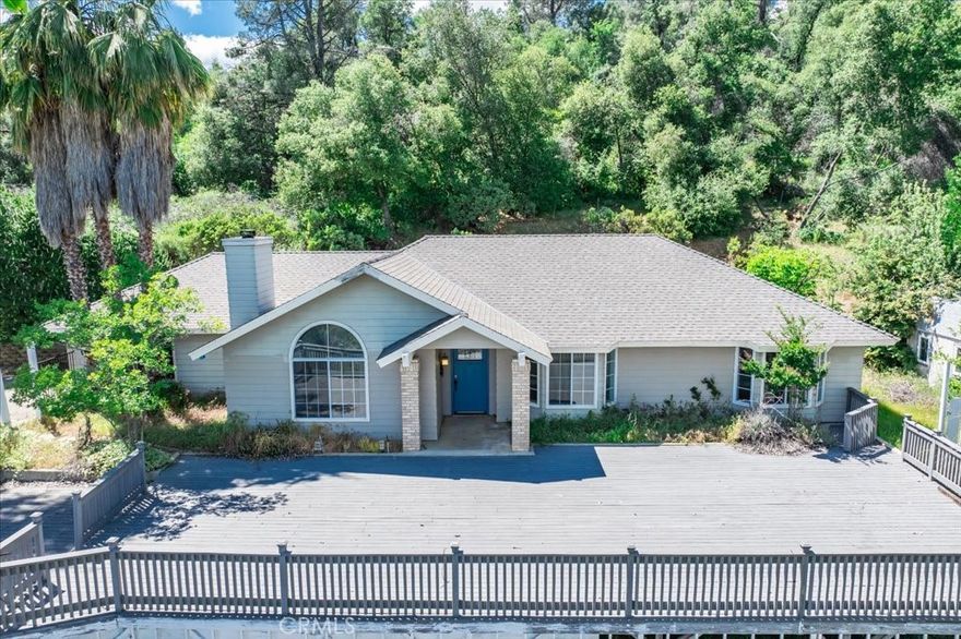 Take advantage of an assumable VA loan at an incredible 3% interest rate-a rare opportunity that adds even more value to this special home. Don't miss it!Experience peaceful living in this beautifully updated ranch-style home, perfectly situated on a private 3.4-acre lot with sweeping panoramic views from the front elevation. Just 4 miles from scenic Bass Lake, this 2,070 sq. ft. home sits at the end of a quiet cul-de-sac and features an open-concept layout with 4 bedrooms and 2 bathrooms. Highlights include a luxurious steam shower in the primary suite, a finished and insulated 2-car garage, mature landscaping, ample RV/boat parking, a paved driveway, and two versatile outbuildings. Whether you're looking for a full-time residence or a weekend retreat, this property offers comfort, space, and unmatched tranquility.