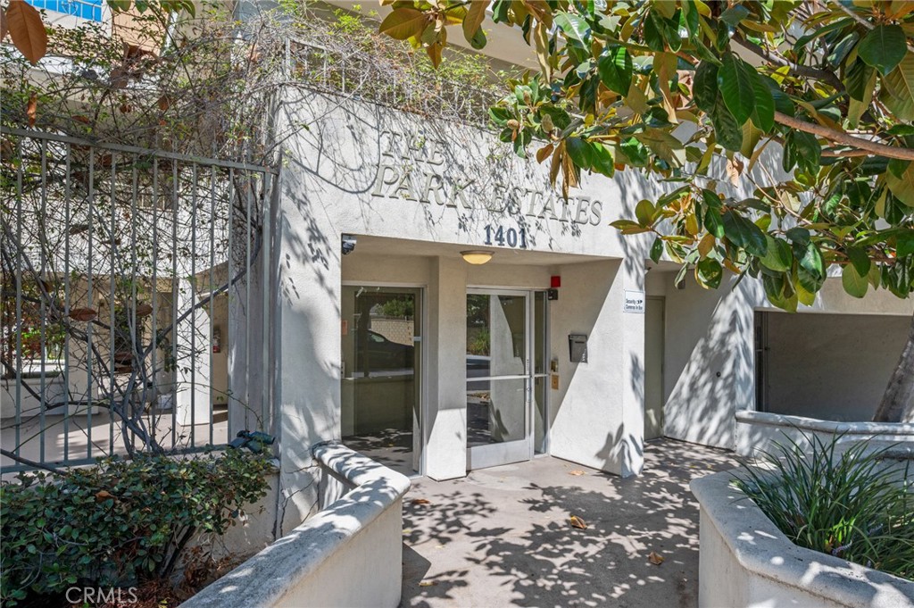 Located in the desirable Park Estates neighborhood of Long Beach, this light-filled condo offers an inviting open floor plan where the kitchen, dining, and living areas flow seamlessly together. The living room features wood laminate flooring, a cozy fireplace, and access to a private balcony—perfect for al fresco dining, relaxing, or entertaining. The kitchen is well-equipped with a gas range, refrigerator, dishwasher, microwave, and a convenient breakfast bar. The bedroom is generously sized with berber carpet and a spacious walk-in closet. Additional features include in-unit washer and dryer, ceiling fans, and an AC unit for year-round comfort. The secured building offers a beautifully maintained courtyard and one assigned parking space in the underground garage. Located near CSULB, Golf Course, shops, and freeway access—and within 2 miles from the beach and the vibrant 2nd Street life—this condo has everything you need in a prime Long Beach location.