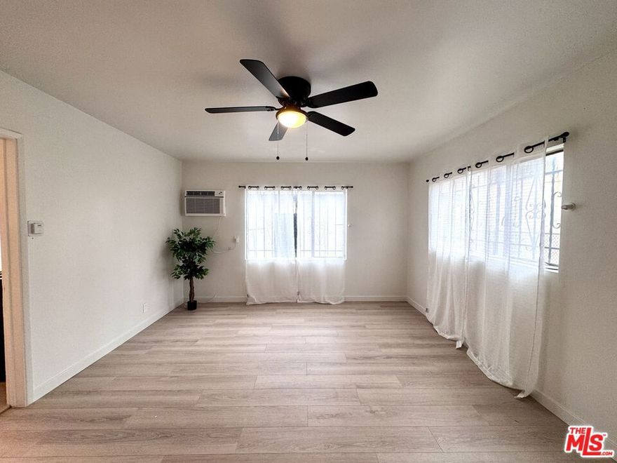 Welcome to this beautifully remodeled 2-bedroom, 1 bath apartment located in the vibrant Harvard Park area of South L.A.  Unit is approximately 760 SF and boasts modern upgrades throughout. The unit is located at the back of the property so it's quiet and gets great morning and afternoon sunlight. Stay cool with wall AC and ceiling fans in the living room and bedrooms and warm with a wall heater in the center of the unit.  The large kitchen can fit a dining set and comes equipped with a refrigerator and stove. Community laundry is available onsite. The unit is pet friendly (1 small dog under 30 lbs is allowed) and of course, Section 8 is welcome.  Don't miss this great unit convenient to the Jackie Tatum Harvard Park Aquatic & Recreation Center and the Frank Garnett Field.  Credit, eviction and background check is required. No smoking.