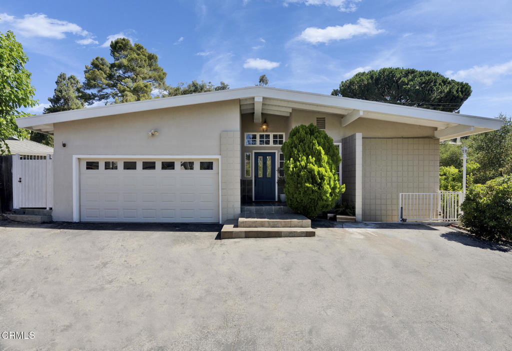 Tucked away at the end of a peaceful cul-de-sac, this beautifully maintained single-story mid-century style home offers the perfect blend of comfort and modern upgrades. Inside, you'll find 3 generously sized bedrooms and 2 remodeled bathrooms with sleek, modern finishes. The open floor plan features a spacious great room with a cozy fireplace, hardwood floors, and double-pane windows, skylight that fill the home with natural light. The remodeled kitchen is the centerpiece, boasting a large island ideal for cooking, dining, and gathering.Sliding glass doors lead to the private backyard retreat, complete with a basketball hoop, covered patio, koi pond with waterfall, fruit trees, and a deck overlooking lush mature green tree- a serene setting for both relaxation and play. Upgrades include a newer roof, fully paid-off solar panels, and a whole-house water softener for everyday convenience and efficiency. Located within the prestigious National Blue Ribbon School District and near Anderson W. Clark Magnet High School, this home offers timeless style, thoughtful updates, and a prime La Crescenta location.
