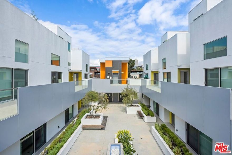 Set within a gated boutique building just moments from the best of Santa Monica, this thoughtfully designed corner-unit 2 bed, 2 bath home blends contemporary comfort with coastal ease. The open-concept living and dining areas creates an airy, inviting flow that continues into the kitchen outfitted with premium Viking and Bosch appliances. The true gem of this residence is its expansive private yard, a rare wraparound outdoor retreat with mature hedges and lush grass offering ample space for a children's play area, generous dog run, or simply a serene spot to soak up the south-facing sun. Both bedrooms open directly to this tranquil green space, including a primary suite with generous closet storage and a private bath. Additional highlights include in-unit laundry, secure side-by-side parking with extra storage in the gated garage, and an enviable location near Montana Avenue cafe's, world-class dining, and the iconic Santa Monica coastline. HOA pays for community utilities, landscaping, and gas.