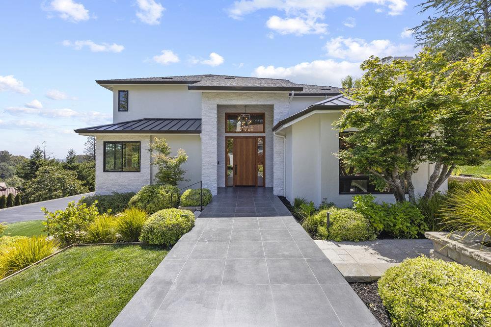 Set on a beautifully landscaped lot, this home offers the perfect balance of luxury, space, & modern convenience. This thoughtfully renovated residence combines timeless elegance with smart-home functionality & high-end designer finishes. The main level welcomes you with a dramatic double-height foyer, formal living and dining rooms, & an expansive open-concept kitchen outfitted with top-tier appliances, custom cabinetry, a large island, & a sun-drenched breakfast nook. The adjoining family room opens to the yard, perfect for entertaining. The main-level primary suite serves as a private sanctuary with its own office, 2 closets, and a spa-inspired bathroom featuring a steam shower, jacuzzi tub, radiant heated floors. Upstairs, 4 spacious bedrooms (3 ensuite) and a second family/media room offer comfort and sweeping views. The backyard is built for entertaining, complete with a pool, spa, built-in BBQ, & lush, mature gardens. Additional highlights include a 3-car garage with EV charger, & ample storage. Enjoy close proximity to award-winning Hillsborough schools, scenic parks, and upscale shopping and dining in nearby Burlingame and San Mateo. With easy access to Highways 280 and 101, commuting to San Francisco, Silicon Valley is seamless.