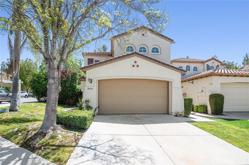Welcome to 28301 Lobelia Ln. an exceptional 4 bedroom, 2.5 bathroom two-story Home nestled in the highly sought-after ‘Wildrose’ neighborhood of Valencia, California. Upon entry, you are greeted by an arched wooden door followed by an inviting interior that boasts a perfect blend of elegance and functionality. Acknowledge the presence of high ceilings and natural light that has made its way through the large windows, providing a warm and inviting atmosphere. Not to mention, the family room offering a cozy like retreat with a fireplace. The kitchen and dining area offers a layout that caters to both cooking enthusiasts and social gatherings. The kitchen features white cabinets with granite counter tops, a great size center island, double oven, dish washer, stove, and a microwave. Other downstairs highlights include a guest bathroom, large storage closet, indoor laundry room, and a finished garage. The upstairs hosts 3 bedrooms, 1 bathroom and a master en-suite. Master en-suite features vaulted ceilings, a stand-up shower, a separate tub, dual sink vanity, and a walk-in closet. Right off the kitchen, the sliding door will lead you to your private oasis. The location is truly picturesque, with rolling hills and nearby bike and walking paths providing the perfect backdrop for an active lifestyle. Close to the city's best schools, paseos, parks and the HOA's many amenities including tennis courts, three swimming pools with jacuzzies and kiddie pools, a basketball court, and a modern rental clubhouse with a full kitchen and outdoor barbecues! Don't miss the opportunity to make this your new home - a place where style, comfort, and convenience converge. YES HOA; NO Mello-Roos!