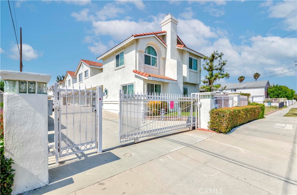 Don’t miss out on an opportunity to call this townhome yours. The community is guarded by a security gate and there is no one above you or below you. This 2 bedroom, 2 bathroom of 1,110 sqft living space townhome has a lot to offer. This two-story home is airy and bright with lots of natural light coming in during the day. The entire bottom floor is the 2-car garage with washer and dryer hookups and all the living spaces are upstairs. As you walk up to the living room the cozy fireplace with the open floorplan leading to the kitchen will welcome you. The dining area also has cabinetry spaces with a sink and can be turned in to an extra serving area. Don’t be surprised to see the master ensuite with attached office space. It may look like an extra room and can be used as one, but it’s for the people dreaming to have their own home office. You can even walk out to the balcony for a quick break and fresh air. Both 2 bathrooms have a full tub with shower and master bathroom has dual sink vanity and walk-in closet. This home is in close proximity to the 5, 605 and 91 freeways and Cerritos College.