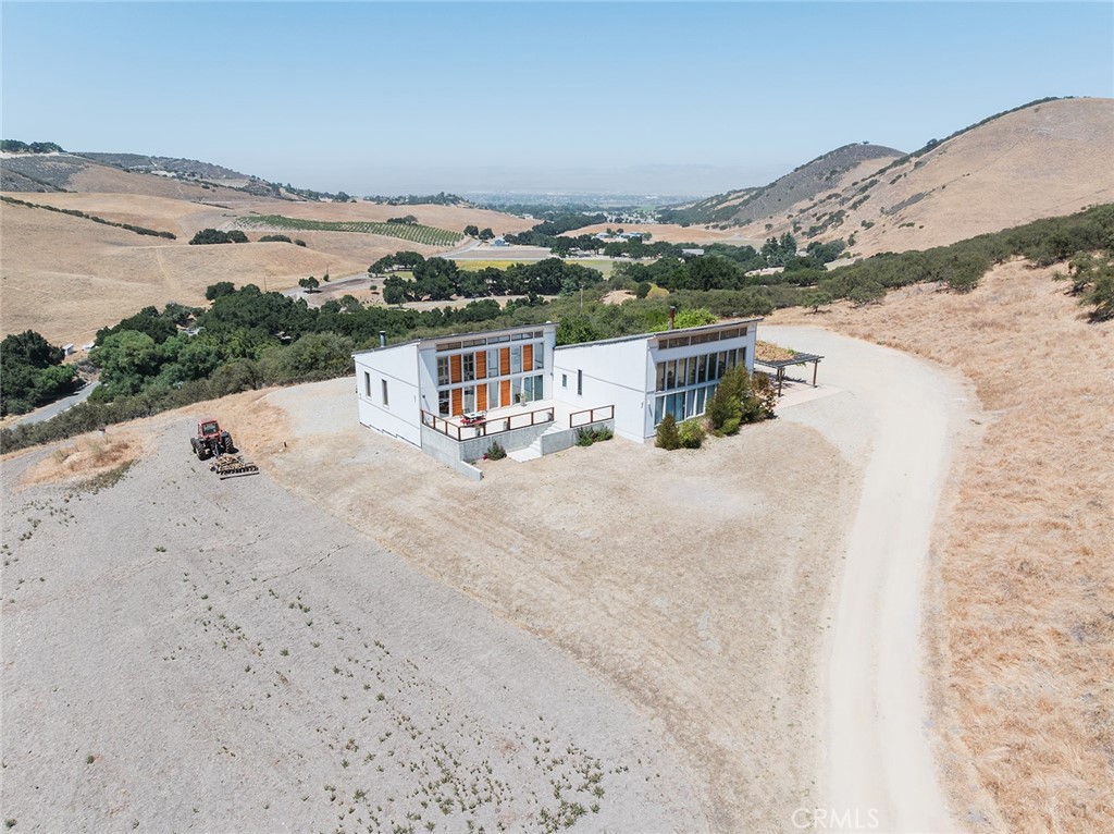 Modern design meets peaceful country living!
Unwind in style with this stunning single family home featuring contemporary finishes and open-concept living, perfect for relaxing and entertaining.
This unique home has incredible views up pine canyon and down all the way to King city. Enjoy the feeling of serene seclusion although you're conveniently minutes from downtown. Sit back on any of the large concrete patios and watch the local deer and turkeys pass by.
Situated on 4.35 acres of land,there's plenty of space to garden or even keep horses and chickens. The passive solar design of the home incorporates strategically placed windows to maximize natural light and ventilation to the home. The home has two wood burning stoves to keep cozy in the winter.
Schedule your private tour today and experience the beauty of this home firsthand.