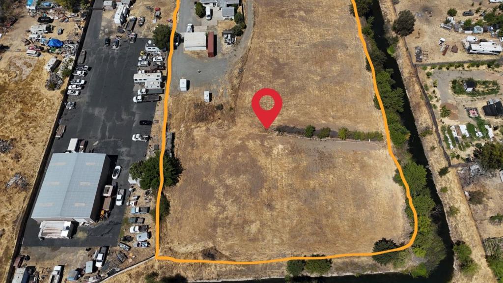 Rare opportunity in Sacramento: 3.31-acre parcel zoned M-1S-R light industrial with residential overlay offering huge potential for truck, RV, or large-vehicle parking, storage, or yard use. Includes a 2-bedroom/2.5-bath single-family home (approx. 1,344 sq ft), ideal as caretaker residence or office. Massive flat lot with plenty of open space to accommodate rigs, trailers, RVs, or commercial fleet, and room for expansion. Zoning (M-1) supports industrial / light commercial uses; permitted or conditional uses may include vehicle storage, parking & loading operations in many circumstances. Property layout and access make it practical for truck-yard or RV storage business. No sign at the property, call today to schedule a tour and explore the possibilities!