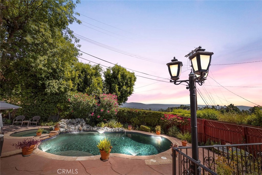 Hidden Gem in Encino with exceptional VIEWS! Located in a prime SOUTH OF THE BLVD area, on a quiet CUL-DE-SAC in one of the area’s most sophisticated pockets, this home offers unmatched serenity while remaining just moments from the vibrant heart of Ventura Blvd.
Enjoy spectacular panoramic valley views from nearly every room, filling the space with natural light. The home features 3 bedrooms, 2.5 bathrooms, hardwood floors, french doors, and a spacious living room with large picture windows and a fireplace. The layout includes a formal dining area and a cozy den, ideal for entertaining.
Step outside to an expansive entertainer’s deck with breathtaking views, a pebble-finished pool with a color-changing jacuzzi, waterfall feature, and a saltwater system.
While the home may need a bit of TLC, its location, views, and outdoor living potential make it a rare find. A true blend of privacy, charm, and the best of California living - don’t miss this opportunity!