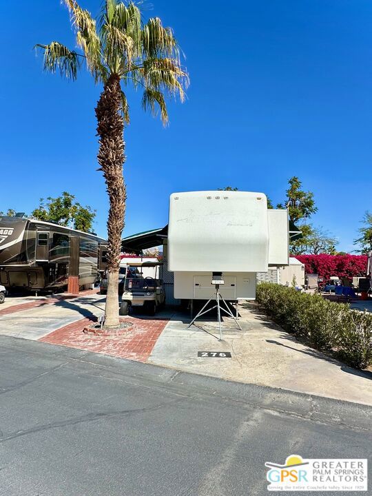Discover the perfect RV lot in the highly sought-after Desert Shadows RV Resort, a gated 55+ community with 460 units. This beautifully landscaped lot features mountain views front and back, a back privacy wall, a shed, and lush greenery maintained by the park, creating a serene retreat. Enjoy easy access to exceptional resort amenities, including six heated pools, an Olympic-sized lap pool, an indoor pool, spa, sauna, gym, and laundry facilities. The community also offers sunken-lit tennis and pickleball courts, an indoor shuffleboard pavilion, a fully equipped fitness center, a library with Wi-Fi and broadband, and various activity rooms for cards, crafts, and hobbies. Additional amenities include a dance studio, woodshop, putting green, and multiple picnic areas, fostering an active and social lifestyle with organized events and clubhouses. Ideally situated with mountain views, this lot is part of a vibrant and well-maintained community. The low HOA dues of $420 per month include access to all resort amenities and events, basic cable, free clubhouse Wi-Fi, water, trash, sewer, recycling, and landscaping in and around the unit. For those seeking a complete setup, the lot can be purchased with a 40' Augusta III PR RV for a total package price of $99,000. Don't miss this fantastic opportunity to own a premium RV lot in one of the area's most desirable resort communities. Contact us today for more details!