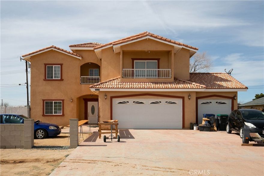 Welcome Home to this bright and inviting Two-Story, 5-bedroom, 3-bathroom Spanish style home with an entertainer's backyard with covered patio. The home features 2,918 square feet of living space with 1 bedroom and 1 bathroom on the main floor and four bedrooms and 2-bathrooms upstairs. This home is an entertainer's dream with a huge kitchen and oak wood cabinetry.  Large family room with formal living and dining room. This home has a huge master suite with room for a sitting area to relax, balcony access, two closets and jet tub in the master bathroom. The remaining 3-bedrooms are nicely sized with two of them having balcony access as well. This home is in a prime location with close access to shopping, and dining. This home is a must see.