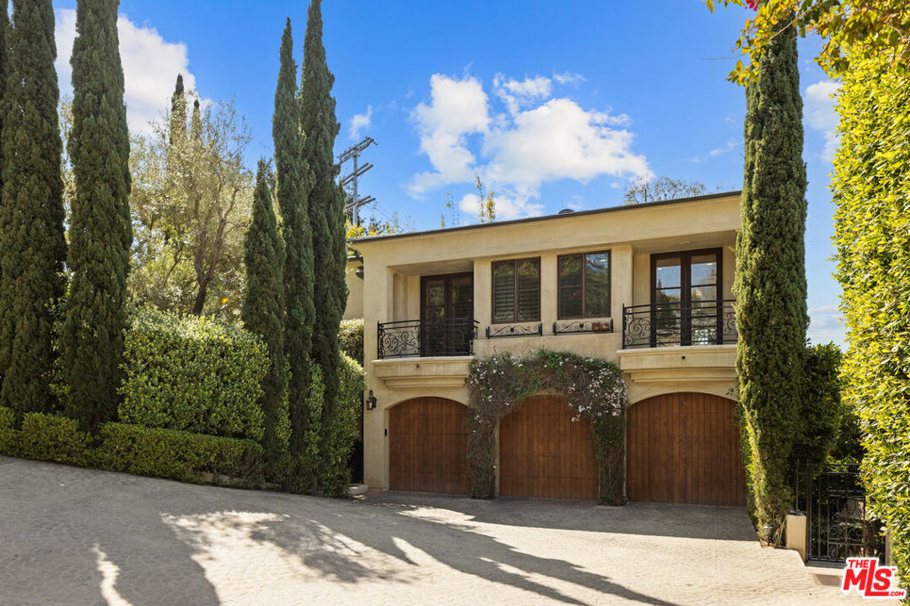 Timeless Mediterranean Villa accented with thoughtful wood, stone and custom cabinets while providing all the modern day amenities one could ask for. The main upper level provides canyon and ocean views from the oversized, open cook's kitchen/family room with a fireplace. A cozy formal living room/library, also adorned with a fireplace, and the formal dining room are both adjacent to the kitchen. Two bedrooms en-suite plus the luxurious main bedroom are all on one level. The lower floor offers a fourth and potentially 5th bedroom and bath plus a large screening/game room and in addition a large flex office/gym space both leading to the outdoor gardens. The garden level also provides a lovely outdoor entertainment environment including an outdoor fireplace and kitchen adjacent to the grassy yard. When coming home one drives down the cobblestone path to a motor court, through the gates, where one is immediately drawn into the private gracious environment with the backdrop of Santa Monica Mountains before slipping into the three car garage. This sophisticated European style dwelling is in close proximity to Santa Monica, State Beach, Canyon Square and Canyon Elementary.