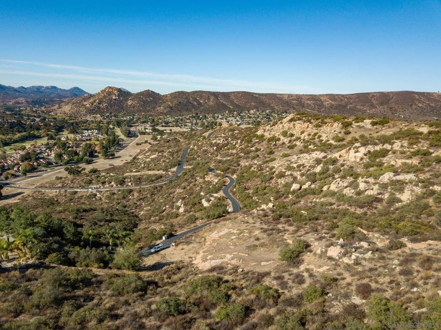Discover this unique 8+ acre hilltop property located in the heart of San Diego Country Estates—without the constraints of the SDCE HOA. This exceptional parcel offers a rare opportunity to build your dream home in a serene, elevated setting. Tucked behind a gated entrance shared by only three other properties, it provides an added sense of privacy and security—an ideal retreat in today’s uncertain times. Come walk the land and envision the possibilities for your forever home.