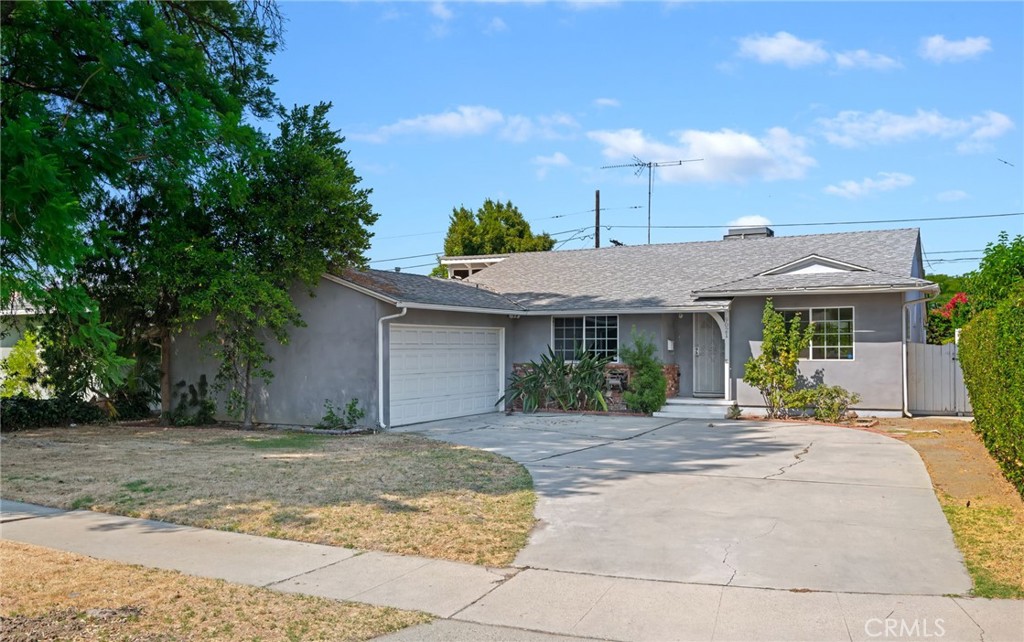 Nestled on a quiet street close to shopping, dining, schools and parks nearby, this three bedroom, two bathroom home with a pool is ready for you to call home. This home has hardwood floors and the interior was recently repainted and has features of new and old. The living, dining and kitchen areas are spacious with plenty of room for entertaining. The den area off the kitchen has a small fireplace area that you can use for grilling, and opposite to that, in the living area, is a wood burning fireplace. There are two bedrooms off the living area with a full bathroom in the hallway, and the primary bedroom with a 3/4 bathroom with double vanity. The backyard features an in-ground pool and above ground jacuzzi. The garage is a two car, non-direct access garage with plenty of storage. There are several parks, schools, grocery stores and restaurants nearby. Come make this home your next home.
