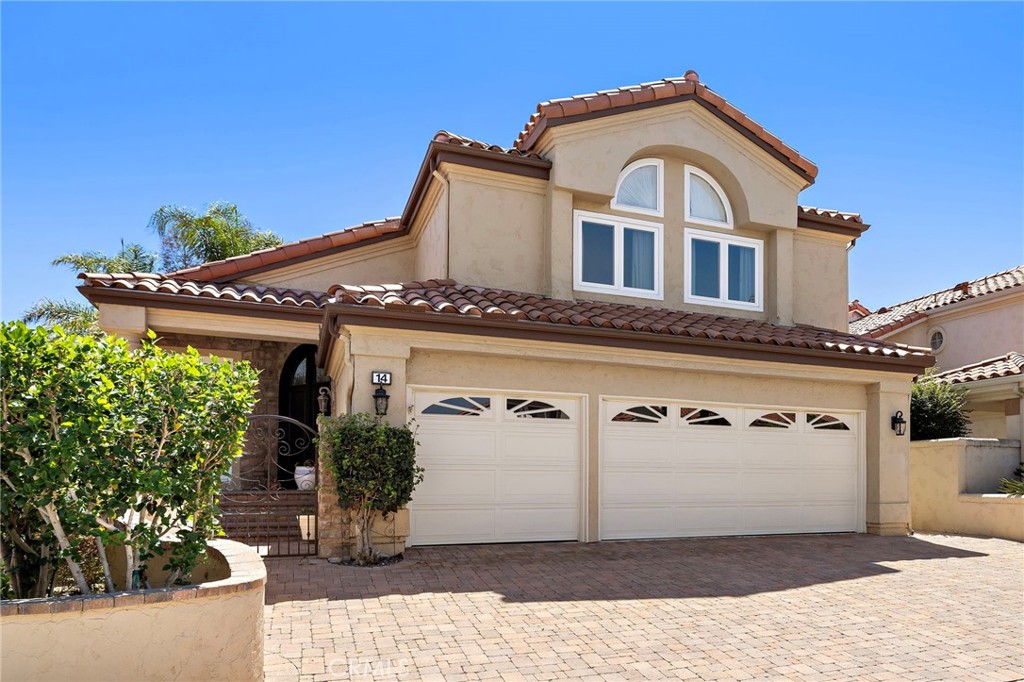 Welcome to this exquisitely upgraded 5-bedroom, 3.5-bathroom home offering 3,018 sq. ft. of luxurious living space, perfectly situated on an expansive lot with a partial scenic ocean view.
From the moment you arrive, the Tuscan-inspired exterior makes a striking impression with custom-designed Renaissance windows and doors, professionally landscaped planter areas, high-end entry gates, and a sweeping decorative Olsen Pavers driveway leading to a spacious 3-car garage—delivering exceptional curb appeal.
Step through the grand arched double doors and you'll immediately feel the pride of ownership in every detail. The entry opens into a warm and welcoming living and dining area with rich, handscraped Rustic Walnut wood flooring that flows seamlessly throughout much of the downstairs. Ideal for multigenerational living, a private, large downstairs bedroom with en-suite bath offers comfort and flexibility.
The family room is an inviting retreat featuring a custom fireplace and opens into a bright and airy vaulted sunroom/office through elegant French doors. Bathed in natural light from expansive Renaissance arched windows, this versatile space is perfect for working, relaxing, or entertaining.
The open-concept kitchen is a chef’s dream—featuring a stunning arched picture window with backyard views, granite countertops, designer tile backsplash, top-of-the-line KitchenAid appliances, and a generously sized walk-in pantry with custom shelving.
Upstairs, the expansive primary suite is a true sanctuary, complete with a spacious retreat area that can easily function as an additional bedroom or private lounge. The spa-inspired en-suite bath is beautifully appointed with marble floors and walls, an Aruba Gold travertine shower, and matching vanity countertops that add elegance and warmth. All bathrooms throughout the home have been equally upgraded with luxurious finishes.
Step outside to a beautifully landscaped backyard oasis with lush greenery, an elaborate Olsen Pavers patio, and thoughtfully designed planter areas—perfect for entertaining or enjoying the peaceful coastal breeze. From here, take in the partial ocean view and serene atmosphere.
This home is truly a rare find—thoughtfully upgraded, meticulously maintained, and move-in ready. Your buyers will be impressed by the exceptional quality, attention to detail, and timeless design throughout.