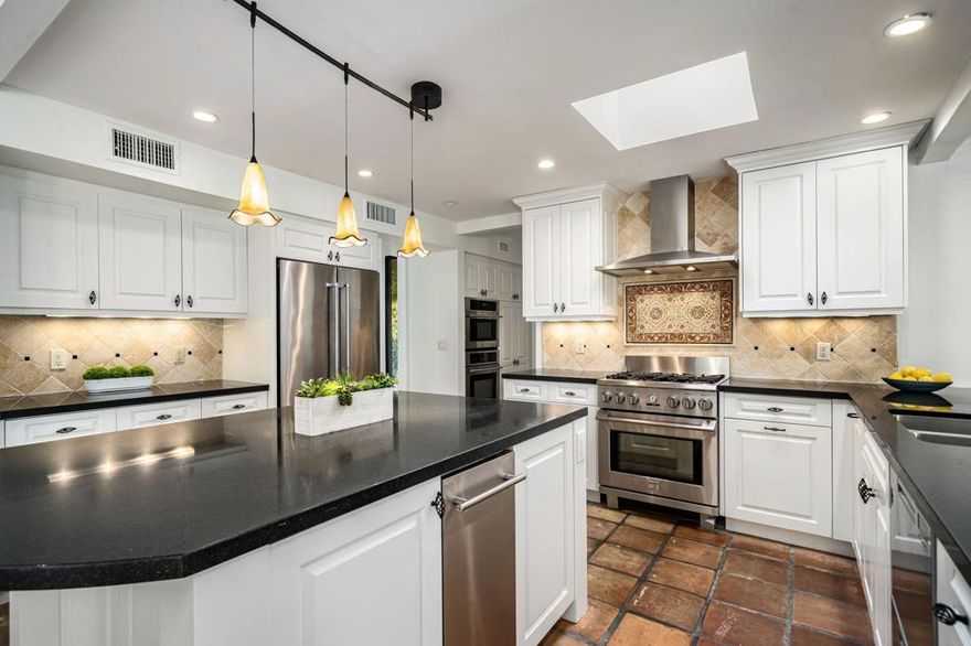 Tucked within the coveted Tamarisk area of Rancho Mirage, this quiet cul-de-sac residence offers a refined blend of sophistication, comfort, and effortless desert living--delivering amazing value in one of the valley's most desirable settings. Manicured landscaping and inviting curb appeal immediately set the tone for light-filled interiors, where multiple skylights and fresh, whole-home interior paint create an bright and airy ambiance. The open-concept kitchen--appointed with premium stainless steel appliances--anchors two expansive living and dining areas, while a charming fireplace framed by a custom built-in bookcase adds warmth and architectural character. The spacious primary bedroom suite enjoys tranquil views of the pool, further enhancing the home's private, resort-like atmosphere. New door hardware throughout provides a crisp, contemporary finish.Set on an oversized lot, the outdoor environment unfolds into a serene retreat featuring a sparkling pool, soothing spa, and mature trees. Fully owned solar panels elevate both efficiency and long-term value. Whether you are looking for a full-time home or an elegant winter getaway, this exceptional property promises comfort, privacy, and elevated desert living. Ideally located minutes from El Paseo, Rancho Mirage's finest shopping and dining, downtown Palm Springs, and the Palm Springs Airport. Call for your private showing today.