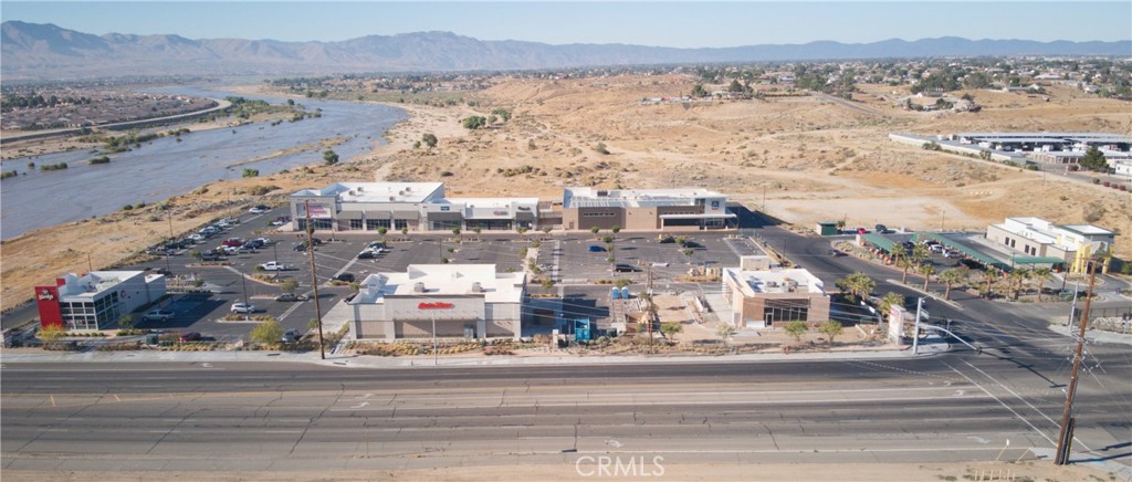 Grocery anchored shopping center. Signalized intersection. Current tenants in the center include Aldi, Planet Fitness, Quick Quack Car Wash, Auto Zone, Wendy’s, & Panera Bread. Located across the street from Victor Valley College with a headcount of ±25,216 students that includes credit, non-credit, non-residents and contract ed. Free standing pylon signage available along Bear Valley Rd. Located west of Jess Ranch Marketplace.