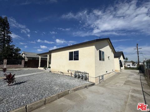 Photo of 1215 W 104th Street, Los Angeles, CA 90044 (MLS # 26643289)
