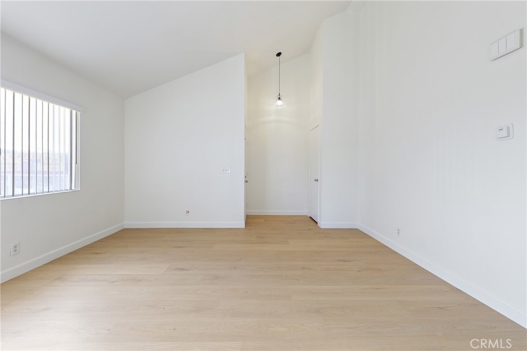 RENOVATED UNIT WITH AN OPEN FLOOR PLAN AND PLENTY OF NATURAL LIGHT! Step inside and immediately notice the perfect open-living concept with vaulted living room, dining area and kitchen all connected, perfect when entertaining guests. Completely remodeled kitchen with quartz countertop, white shaker cabinets with plenty of storage space, brand new appliances and a deep single stainless steel kitchen sink. Fresh paint throughout the entire interior. New vinyl wood flooring throughout. The living/dining area offers direct access to your own outdoor patio space. The sizeable one-bedroom includes a spacious closet and a window, inviting plenty of natural light in. The bathroom features matching new quartz countertops, new cabinets, fixtures and new stand up shower that perfectly compliment the rest of the home. Rent includes Trash, Sewer, & Water. The unit comes with a 1-car detached garage as well as 1 uncovered carport space. Community washer and dryer conveniently located on the property in a separate room just steps away! Located to many restaurants, shops, and entertainment. Easy access to the 55 freeways.