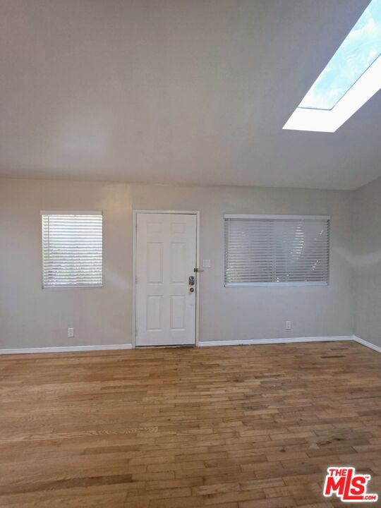 This inviting one-bedroom, one-bath apartment is located in the heart of Venice, just a few blocks from Abbot Kinney Boulevard and minutes from Venice Beach. With vaulted ceilings and a skylight, the living area is filled with natural light, creating an airy and spacious feel. The kitchen comes complete with stainless steel appliances, refrigerator, gas stove, and microwave, while the apartment features wood flooring throughout for a clean, modern look. A private wood deck offers the perfect spot to relax outdoors, and your own washer and dryer on the patio provide everyday convenience. Parking is simple with two tandem spaces available under a separate lease for just $10 per month. Set in one of LA's most desirable neighborhoods, this home offers the best of coastal living: trendy boutiques and dining on Abbot Kinney, the energy of Venice Beach, and the relaxed charm of a residential street.