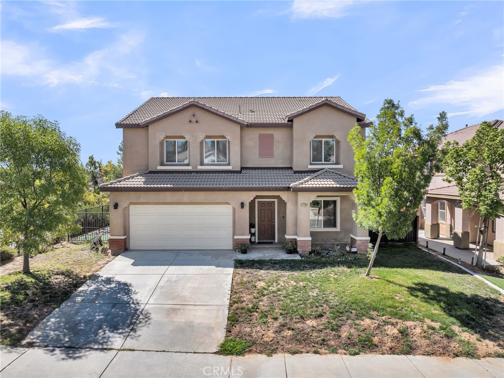 Perched on a premium lot overlooking the park with a larger backdrop of the San Jacinto mountains, this Shadow Creek home offers 5 bedrooms and 3.5 baths across 2,882 square feet. Spacious and open common areas define the first floor with the cornerstone being the gourmet kitchen with quartz counter tops, abundant cabinetry, tiled backsplash, stainless steel appliances, and large center island with breakfast bar seating. Upstairs, 5 bedrooms expand out from a central hallway. The primary bedroom is located on the southeast side of the home and enjoys sweeping views over the park below, the local landscapes, with San Gorgonio Mountain and the San Jacinto mountains on the horizon. These views can be enjoyed from the primary bedroom, or the expansive ensuite bathroom that boasts dual sinks with quartz counter tops, a separate tub and shower installation, and a generous closet. 4 bedrooms and 2 additional full bathrooms complete the second floor. Outside, a concrete patio, shaded by an alumawood patio cover, expands out to meet the ribbon of turf in the rear yard. With only one neighboring home, expansive views, upgrades throughout, and turnkey condition, this home is a great opportunity.