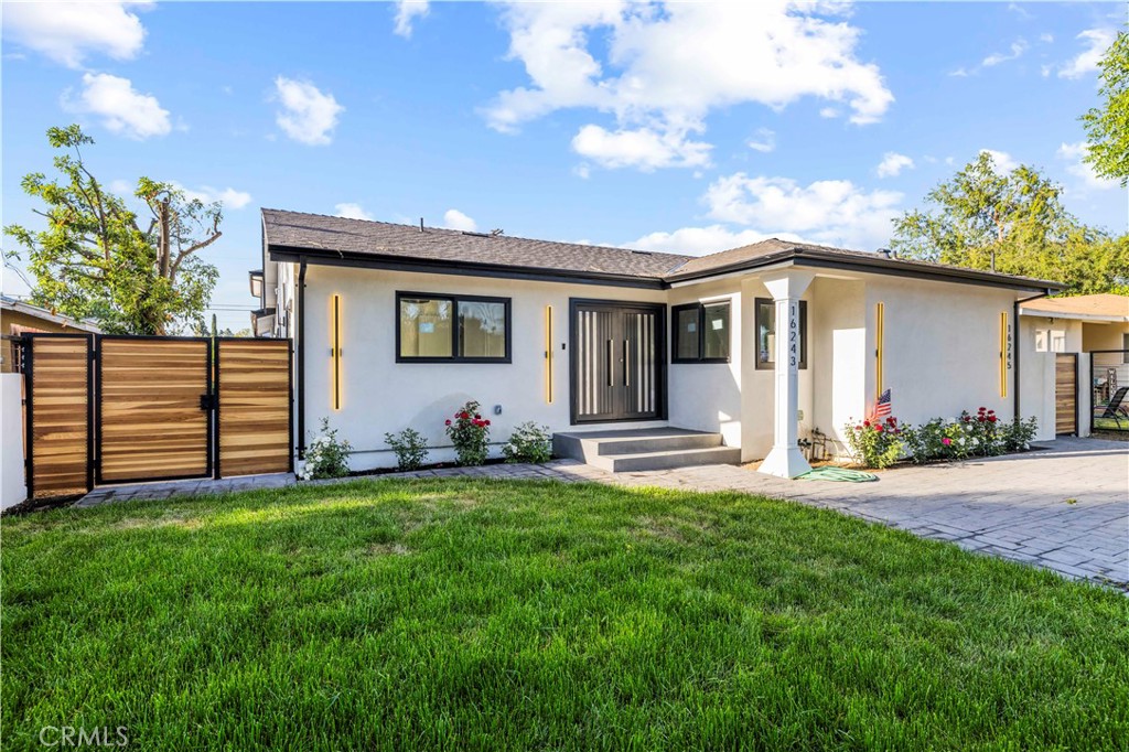Unveil a lifestyle of sophistication in this impeccably remodeled 3-bedroom, 2-bath residence, gracefully situated on a quiet cul-de-sac in coveted Granada Hills. From its pristine white façade and rich wood accents to its modern designer lighting, every detail radiates curbside allure.
Step inside to an expansive open layout bathed in natural light, where wide-plank flooring, arched passages, and a sleek gas fireplace create an ambiance of understated luxury. The gourmet kitchen is a culinary showpiece—adorned with marble countertops, a dramatic marble waterfall island, brass fixtures, premium appliances, a farmhouse sink, and a built-in wine fridge.
The spa-inspired bathrooms evoke pure indulgence with frameless glass showers, radiant LED mirrors, elegant gold finishes, and a sumptuous soaking tub. Thoughtful touches continue throughout, including central HVAC, black-trimmed dual-pane windows, a stylish laundry room, and a brand-new driveway to be completed before move-in.
Located minutes from Granada Hills Recreation Center with seamless access to the 118 and 405, this residence offers refined comfort, timeless beauty, and everyday elegance.