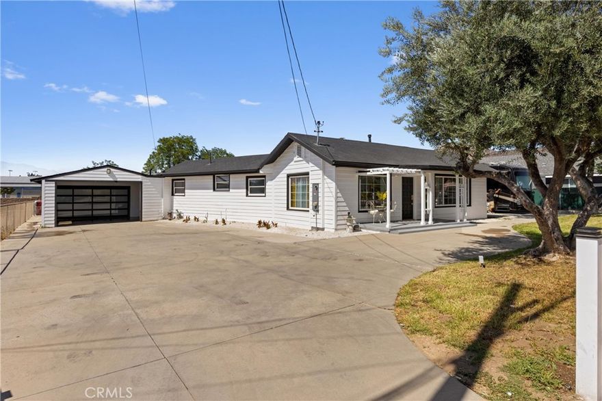 Welcome to Horse Town USA!

This beautifully maintained, turnkey home is ideally located in the heart of Norco—just minutes from the 15 and 91 freeways, and within walking distance to schools and all the amenities that make this unique equestrian community so desirable. The home features two spacious bedrooms and a large ensuite, complemented by brand-new flooring and fresh paint throughout. The front yard is fully enclosed with a new vinyl fence and automatic gates, offering both security and convenience. Step inside to find a generously sized laundry room with a full bathroom and direct access to the backyard—ideal for cleanup after a day of riding or working outdoors. The fully usable 20,000 sq ft lot offers endless possibilities, with plenty of space for animals, trailers, RVs, toys, or future expansion. Out back, enjoy a mini orchard, a spacious storage shed, and ample covered RV parking. The property also features a freshly painted carport that accommodates two additional vehicles, and a brand-new garage door on the attached two-car garage for added curb appeal. Live the true Norco lifestyle with arenas and parks scattered throughout the city, and enjoy close proximity to the 80-acre George Ingalls Equestrian Event Center and the scenic Hidden Valley Wildlife Preserve. Don't miss your chance to own a slice of the Norco dream—schedule your private showing today!