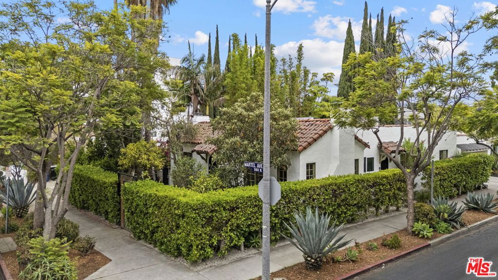 Settle into a mint-renovated Spanish Colonial TIC home in West Hollywood. This bright and charming 2-bedroom, 1-bath unit sits on a quiet, tree-lined street and includes a private yard and garage. This thoughtful renovation incorporates modern necessities while preserving a 1920s vibe. New interiors feature a cook's kitchen with solid wood custom cabinets, gorgeous quartz counters and backsplash, chic Espresso appliances, high-end faucets and hardware, a drinking water filtration system, a convenient under-counter microwave drawer, and a large stacked washer-dryer. Bathrooms are outfitted with custom tiles, a solid Oak vanity with a marble top, and a lighted, mirrored medicine cabinet to hold all of your beauty accessories. With hardwood floors, antique gold fixtures, the original (decorative) fireplace, and a privacy hedge that surrounds your personal garden, this adorable cottage-style TIC home is ready for its close-up. Pet-friendly and walking distance to Plummer Park, Poinsettia Recreation Center, Trader Joe's, Smart & Final, and numerous shops, restaurants, and cafes on Santa Monica Boulevard in West Hollywood.