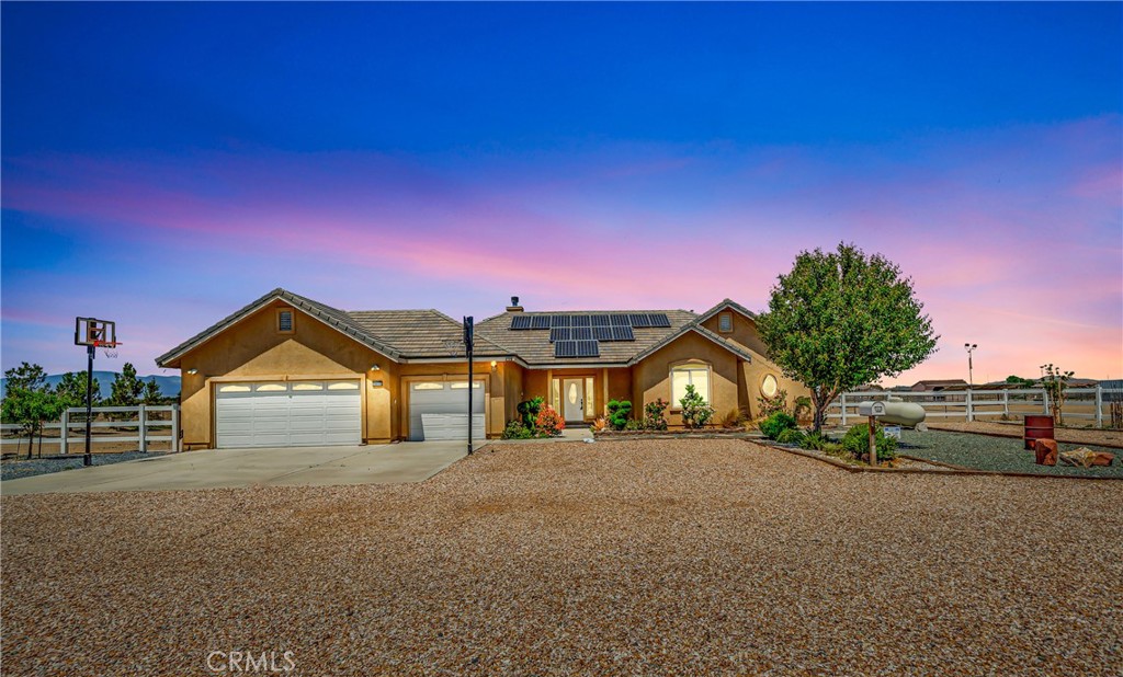 Horse Property! Paid Solar! Workshop! Stunning Horse Property on 2.53 Acres Located in a Desirable Neighborhood in West Lancaster. Move-In Ready! This Exceptional 3-Bedroom, 3-Bathroom Home Offers the Perfect Blend of Comfort, Functionality, & Outdoor Living. The Spacious Open Floor Plan Includes a Family Room with a Cozy Fireplace, a Gourmet Kitchen with Granite Countertops, Abundance of Cabinets for Storage, a Dining Area, Plus a Formal Dining Room. The Master Suite Features a Walk-In Closet, Dual Sinks, a Separate Shower, & a Soaking Tub, while the Additional Bedrooms Offer Large Closets & Ceiling Fans. A Guest Bathroom with Dual Sinks & Granite Counters, a Convenient Indoor Laundry Room with a Sink all Complemented by New Custom Tile Flooring Throughout. The Outdoor Amenities are Unmatched. Designed for Equestrian Enthusiasts, the Property Boasts a 4-Stall Barn with Turnout & Pipe Corrals, an Arena, an Additional Horse Barn, & a Separate Corrals. There's also a Detached Tack Shed & a Storage Shed. RV Owners will Appreciate the Detached Metal RV Building/Workshop with Two Roll-Up Doors, RV Access, & Hookups for Relaxation & Entertainment. Enjoy the Custom-Built Covered Gazebo, Custom Covered Patio, & a Horseshoe Setup for Entertainment. The Property is Beautifully Landscaped with Fruit Trees, Pine Trees, & Thoughtfully Placed Plants & Trees all Lovingly Added by the Seller. Additional Features Include a Spacious 3-Car Garage with Attic Storage. This Home is a Rare Opportunity to Own a Move-In-Ready, Fully Equipped Horse Property that Combines Modern Comfort with Outdoor Charm. Don't Miss Your Chance to Experience this One-of-a-Kind Property.