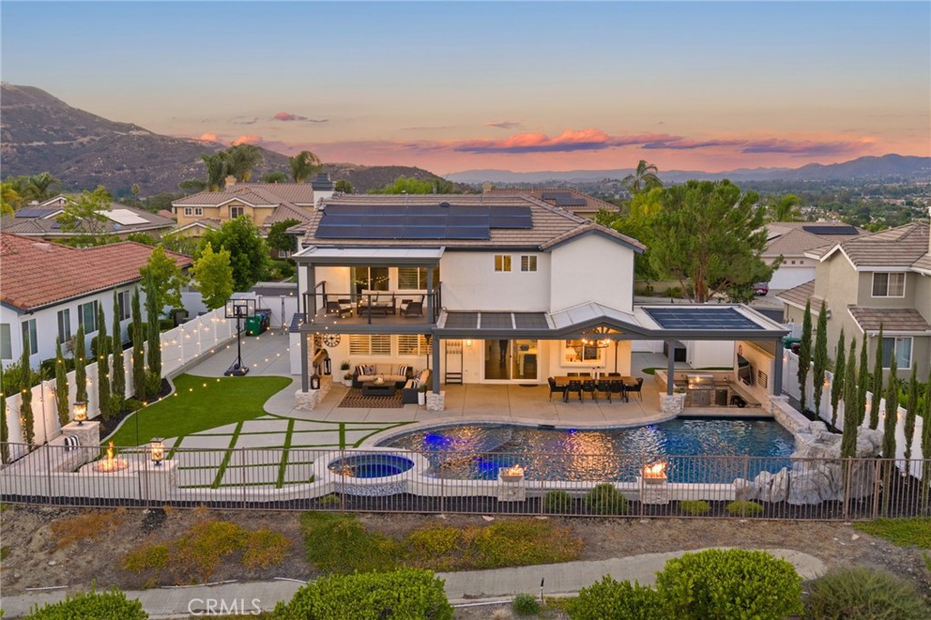Absolutely stunning and insanely upgraded WEST MURRIETA Pool/Spa home!
This 5-bedroom, 3-bathroom luxury retreat offers over 3,000 sq ft of high-end living on a rare 10,000+ sq ft lot with unmatched panoramic city views. Thoughtfully redesigned inside and out, this home blends top-tier design, resort-style outdoor living, and serious energy efficiency, no detail has been overlooked.
Step outside into your private RESORT STYLE OASIS featuring a custom saltwater POOL and elevated SPA with micro pebble plaster, color-changing LED lighting, commercial-grade pool heater, and dedicated pool solar system and NO rear neighbors. Enjoy unobstructed city views, and 4th of July fun in your backyard watching the Murrieta Birthday Bash Fireworks show, but it doesn't just end there, the grand finale happens as you watch ALL the local fireworks show from your very own backyard!
At the center of the backyard is a stunning sunken OUTDOOR KITCHEN, complete with a built-in BBQ, fridge, sink, mounted TV, and a SWIM-UP BAR, truly an entertainer’s dream.
Enjoy cozy nights by the stone fireplace or soak in the sunset from multiple lounge areas surrounded by lush, professional landscaping.
Inside, the open-concept layout is filled with natural light and high-end finishes: a chef’s kitchen with premium appliances and oversized quartz island, designer lighting, custom cabinetry, and smart home features throughout. The primary suite offers a spa-inspired bathroom, huge walk-in closet, and a private balcony with show-stopping city views.
This home is not just beautiful, it’s extremely efficient: PAID OFF SOLAR system, new HVAC system including A/C, furnace & complete ductwork, new tankless water heater, fully finished 3-car garage with heating & A/C – ideal for a gym, workshop, or showroom and RV PARKING!!
Located in a desirable neighborhood close to top-rated schools, shopping, and more, yet tucked away in a peaceful, view-rich setting.
Whether you're hosting a party, relaxing by the pool, or watching the city lights from your backyard or balcony, this home delivers a lifestyle that’s hard to match.
This NO HOA home has everything you want with no detail missed. The West Murrieta home you have been waiting for is finally here!