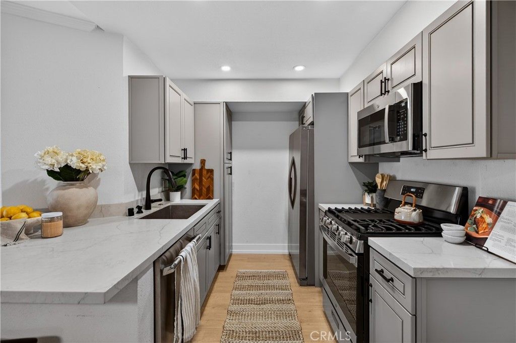 Photo of 5550 Owensmouth Ave #123, Woodland Hills, CA 91367 (MLS # SR26073255)