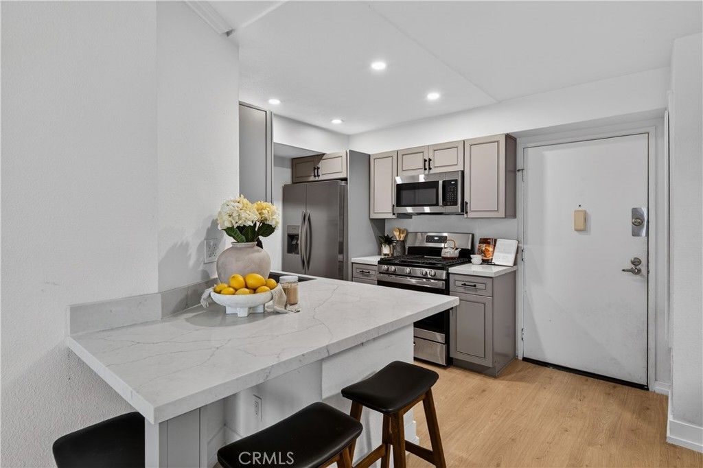 Photo of 5550 Owensmouth Ave #123, Woodland Hills, CA 91367 (MLS # SR26073255)