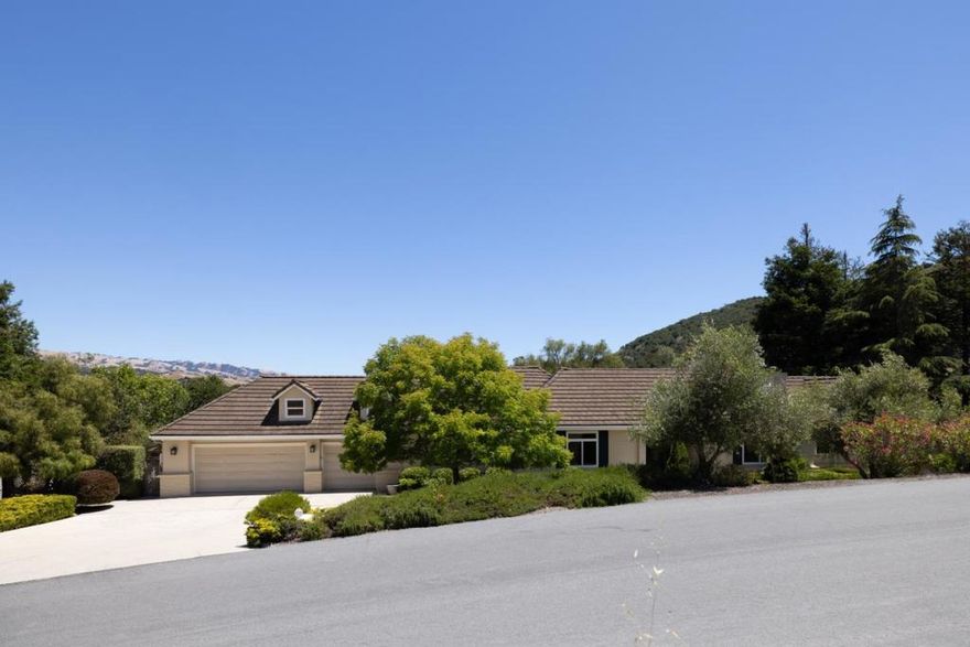 Embrace the Carmel Valley lifestyle in this desirable Vista El Encanto community. Set on 1.83 acres this elegant 4-bedroom, 3-bathroom residence offers 3,158 sq. ft. of thoughtfully designed living space with sweeping views of oak-studded hills and scenic views of Steinbeck's "Pastures of Heaven". Just 20 minutes from the ocean, Carmel-by-the-Sea, Pebble Beach, and Monterey, the location combines tranquility with convenience. Featuring soaring ceilings, abundant natural light, and three fireplaces including a cozy one in the spacious primary suite. This home seamlessly blends comfort and sophistication. Expansive windows frame the stunning natural surroundings, creating a harmonious indoor-outdoor living experience. Ideal for entertaining, the property boasts three distinct yards, a sparkling pool and spa, a charming pool house, and a private artist studio. Located just moments from the Chamisal Tennis Club, this retreat epitomizes California living at its finest.