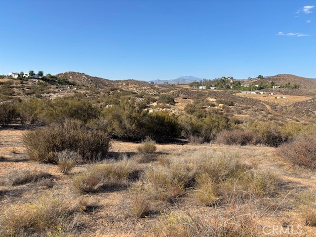 Peaceful area with clean air, privacy and views. Bring your plans and start building or place your manufactured home. Makes for a great weekend get away. Homes not too far away from the property. So much to do, hiking, horseback riding, off road riding, etc. Low property tax. Close to Diamond Valley Lake, Lake Skinner, Vail Lake, Temecula Valley Wine Country. Great for investment! Minutes away from Temecula wine country. Got to See to Enjoy! Motivated Sellers. Don't miss out. Corners are marked and there seems to be no environmental constraints on the full 10 acres. Adjacent neigbor gets 65 gallons/minute. All informaton deemed reliable, but Buyer is recommended to do it's own due dilengence and investigation with Riverside County.