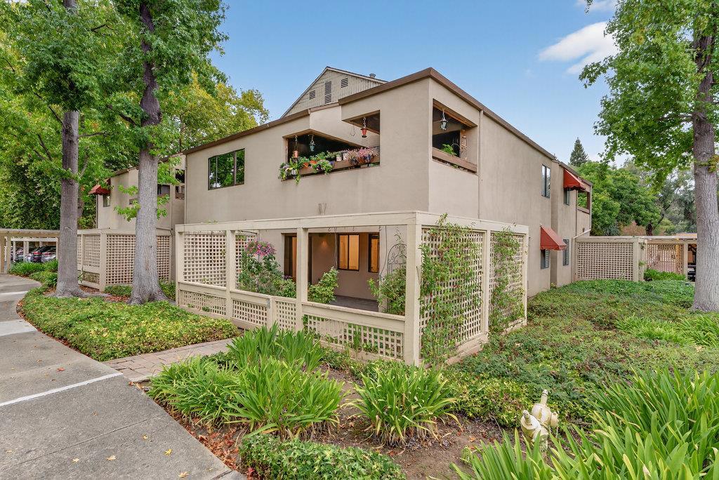 Welcome to the sought-after Los Gatos Commons, a premier 55+ community in the heart of Los Gatos! This inviting ground-level home offers one of the largest floor plans in the complex with a bright, open layout. The updated kitchen opens to a spacious living and dining area, while the primary suite provides comfort and tranquility. A versatile second bedroom works perfectly as a guest room or office. Fresh paint, stylish new lighting, modern bathroom mirrors, and updated flooring give the home a polished, move-in ready feel. Step out back to one of the best patios in the complex, with a view toward the community center and pool...and an approximate 30-second walk away! With three private planting areas, its the perfect spot for gardening or relaxing outdoors. Community amenities include a heated pool & spa, library, billiards, shuffleboard, ping pong, a game-watching area, rentable community space, and regular social activities with other residents. Set on beautifully landscaped grounds, the complex offers a sense of serenity while being only minutes from vibrant downtown Los Gatos, where coffee shops, cafes, fine dining, Art, boutiques, and a lively brew house all await. Experience the perfect blend of comfort, convenience & community. This isn't just a home, its a lifestyle!